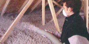 Blown-in attic insulation being installed, shown as an example of proper upgrade practices for Kingston and Area homes by Equinox Home Inspection Services.